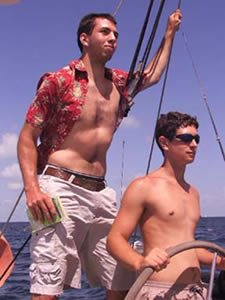 wo boys at helm